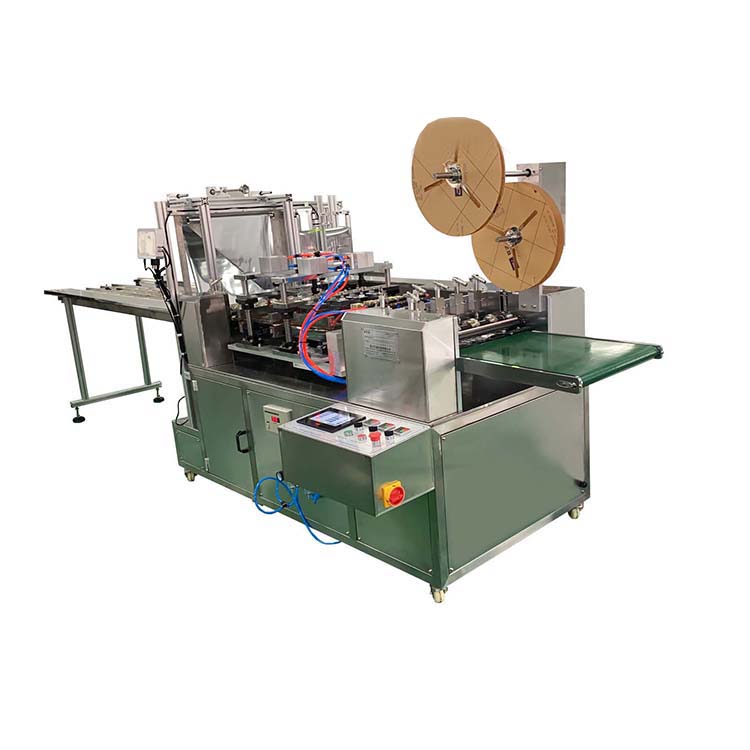 Face mask packaging machine